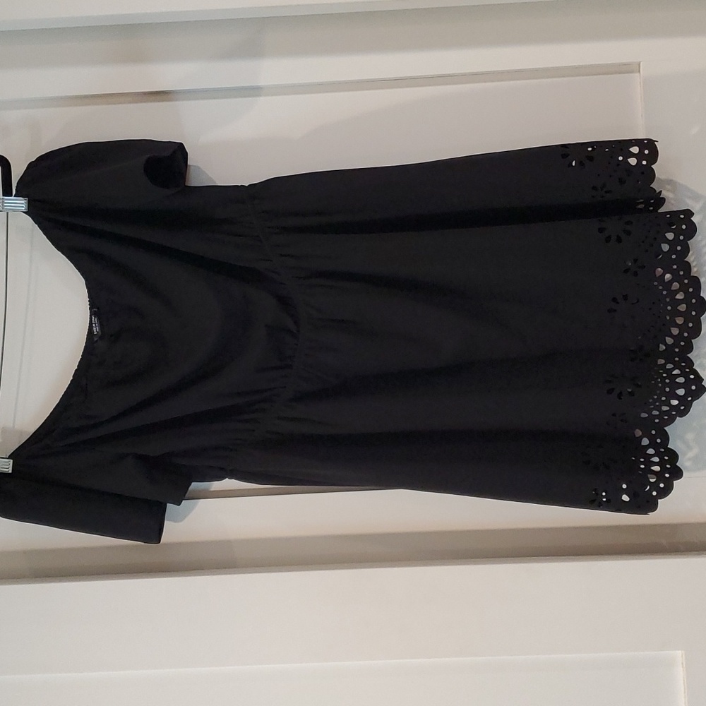 Off shoulder short dress with eyelett cutouts at bottom.  Black size 1XL